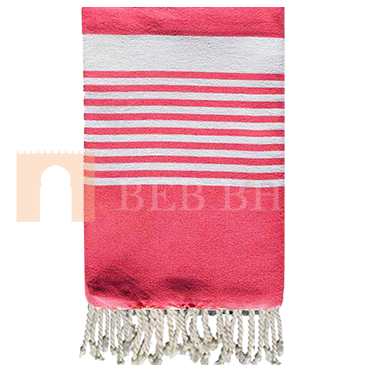 Fouta arthur de couleur corail, multi-utilisation comme serviette de plage ou de hammem mais aussi dans la décoration comme nappe, rideau,...